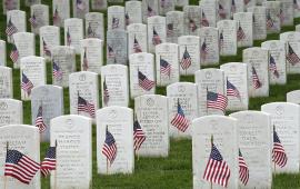 Veterans headstones with flags