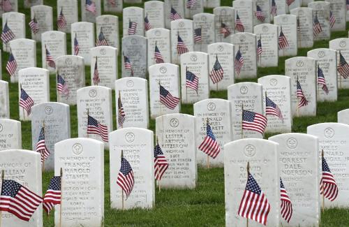 Veterans headstones with flags