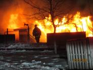 Firefighter in front of flames