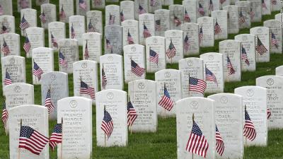 Veterans headstones with flags